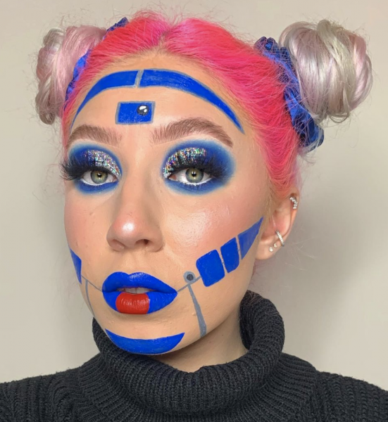Portrait of a woman wearing electric blue makeup