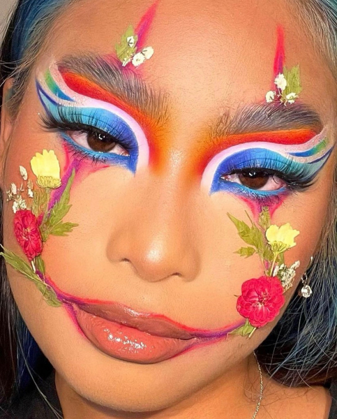 Portrait of a woman wearing colorful makeup on her face