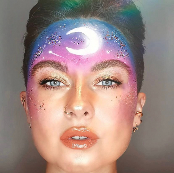 Portrait of a person wearing a moon on the forehead