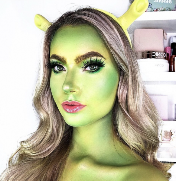 Portrait of a woman wearing light green makeup