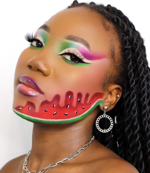 Portrait of a woman wearing a watermelon painted on her face