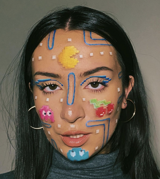Portrait of a woman wearing bright neon makeup on face